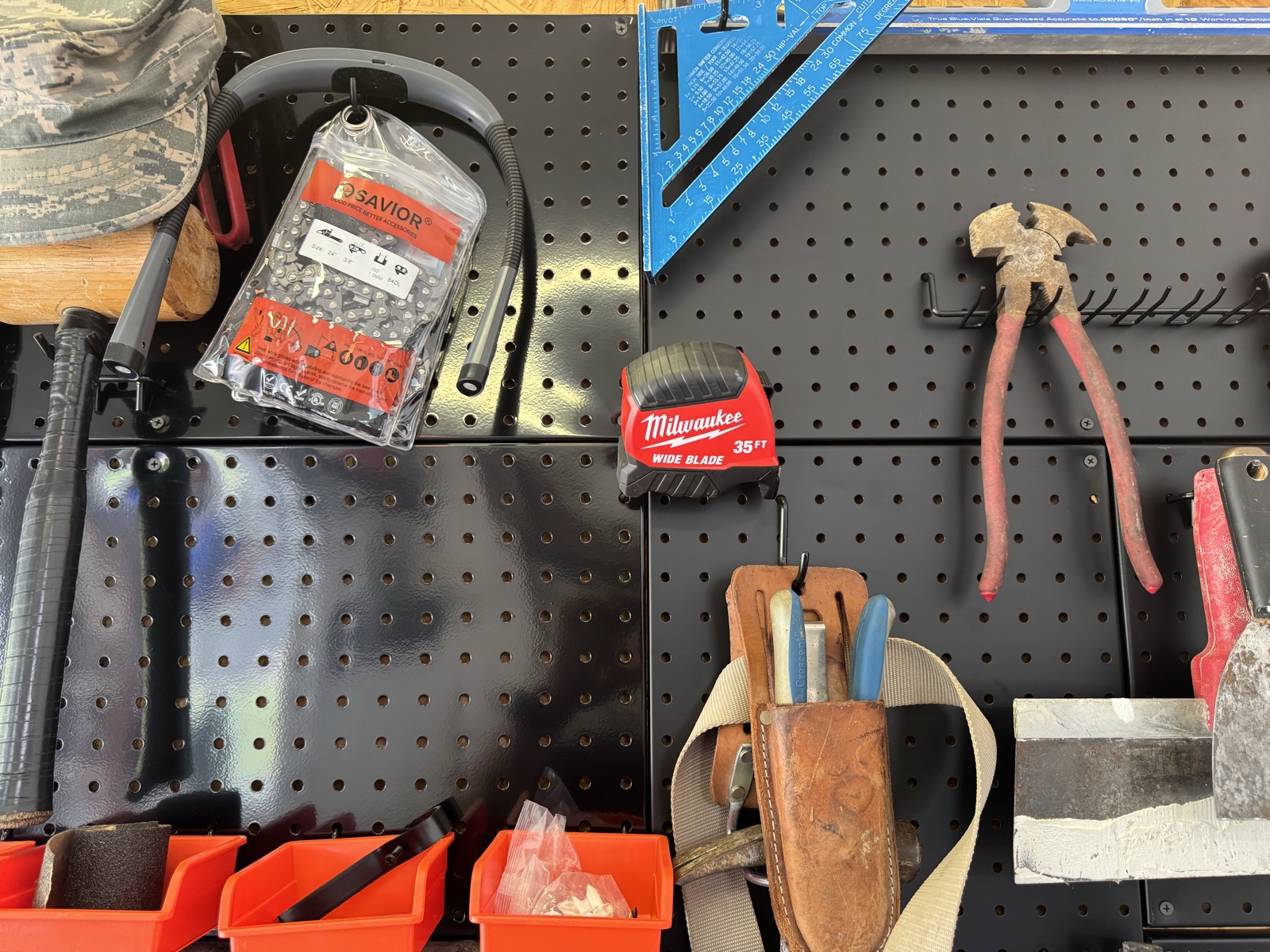 Frequently used tools arranged on a pegboard in the nearby workshop