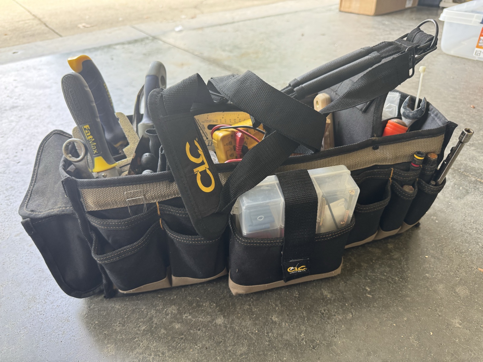 The original large tool bag filled with many different tools