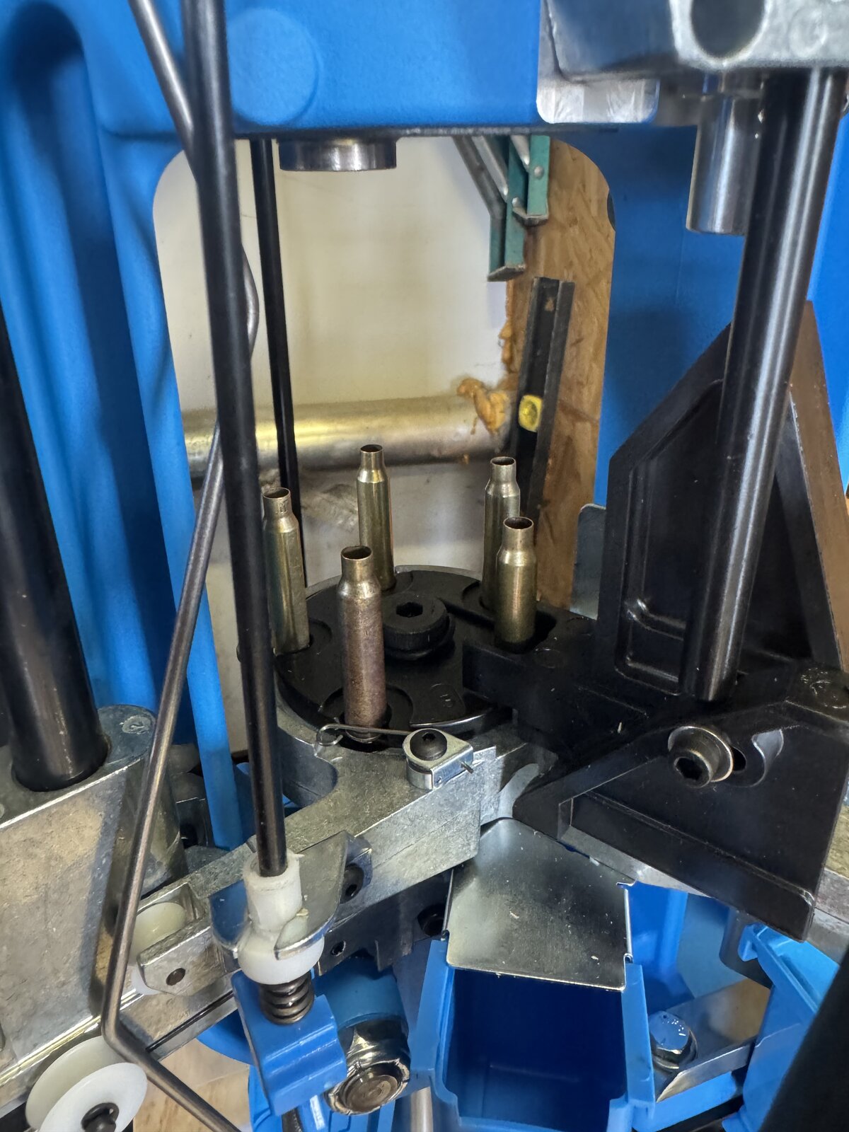 Close view of a progressive press shellplate with four cartridge cases occupying four positions