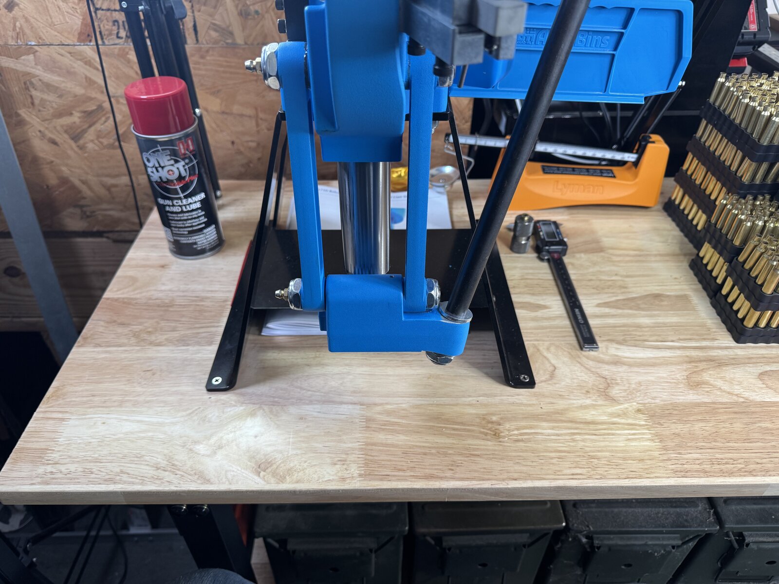 A progressive press mount fastened through the wooden bench after its final position was chosen