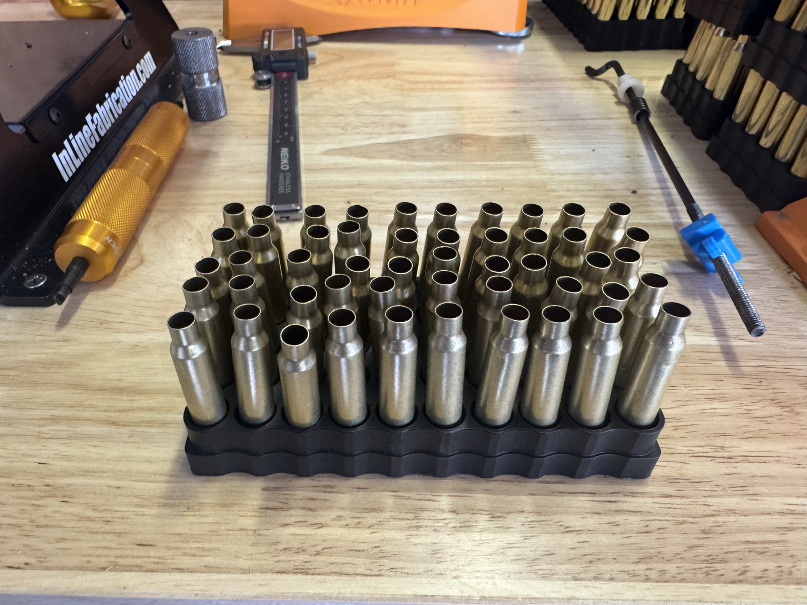 A loading block holding the bounded starting set of once-fired Lake City 5.56 brass